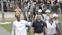 Snoop Dogg sends Paris crowd wild carrying Olympic torch