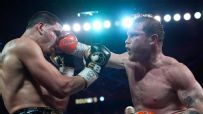 Canelo Alvarez dominates, retains belts in front of sold-out crowd
