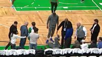 Joel Embiid takes a tumble during pregame warmups