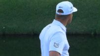 Bryson DeChambeau hypes up the crowd after birdie on 16