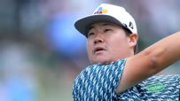 Sungjae Im gives a fist pump after chipping in for eagle