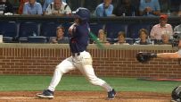 Auburn players go wild as first-base coach goes yard