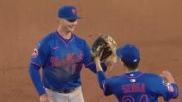 Alonso celebrates out at first after earlier botched throw