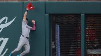 Corbin Carroll leaps to rob Ronald Acuna Jr. of extra bases
