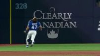 Addison Barger hustles a long way for slick over-the-shoulder grab