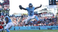 Tyjae Spears leaps into the end zone to increase Titans' lead