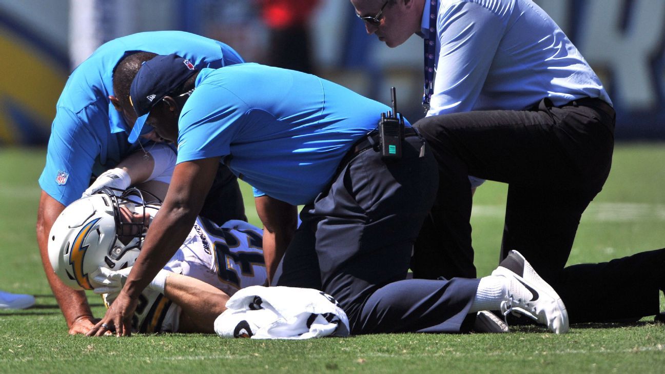 Chargers' Woodhead carted off with knee injury