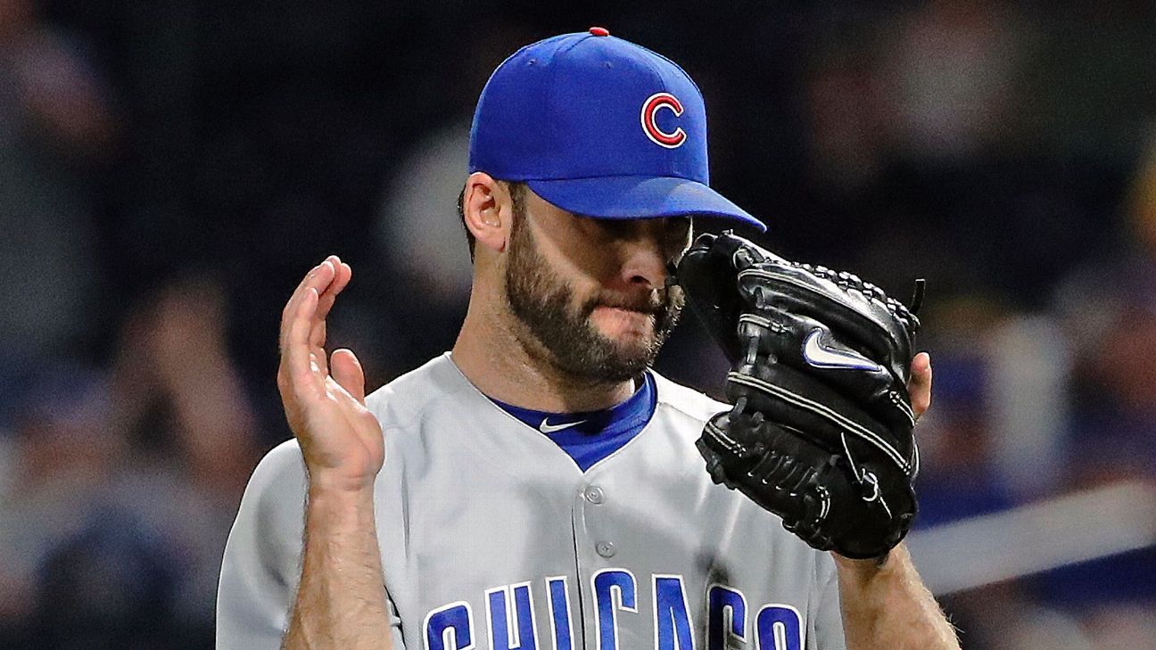Brandon Morrow of Chicago Cubs suffers back spasms while taking pants off