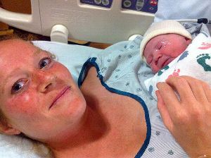 Amber Miller at the hospital with her baby, June