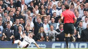 Gareth Bale and the Spurs fans are in shock as referee Andre Marriner turns down a penalty appeal and books the winger for diving