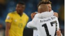Egidio Arevalo embraces Sebastian Fernandez