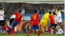 Carles Puyol heads the ball past Manuel Neuer