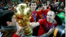 Andres Iniesta celebrates with the trophy.