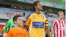 Mitch Cooper leads out the Gold Coast on debut against Melbourne Heart