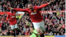 Wayne Rooney wheels away after guiding in Hernandez's cross-shot