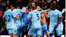 Samir Nasri is mobbed after scoring City's dramatic winner over Chelsea.
