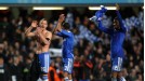 Chelsea players celebrate in front of the club's fans at Stamford Bridge