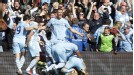 Sergio Aguero is mobbed after scoring a late winner