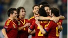 Cesc Fabregas celebrates with his team-mates after putting Spain 1-0 up against Uruguay