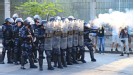 Riot police clash with protestors outside of Maracana stadium