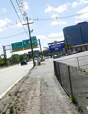 From the gas station where Jason bought a soda and burrito, the walk back to the Hilton Hotel, the large building on the right, is almost entirely along a sidewalk.