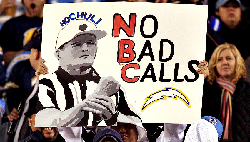 NFL referee Ed Hochuli (85) makes a call during an NFL football