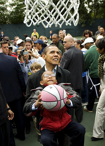 Obama helping young boy