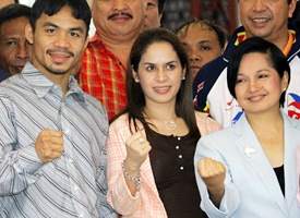 Manny Pacquiao, left, his wife Jinky, center, and Philippine President Gloria Macapagal Arroyo, right