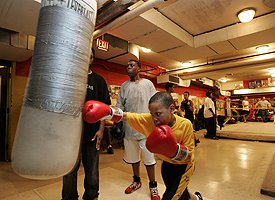 Kid on punching bag