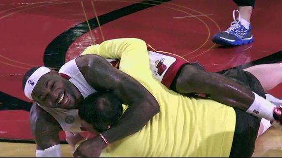 Fan sinks half-court shot, gets hug from LeBron