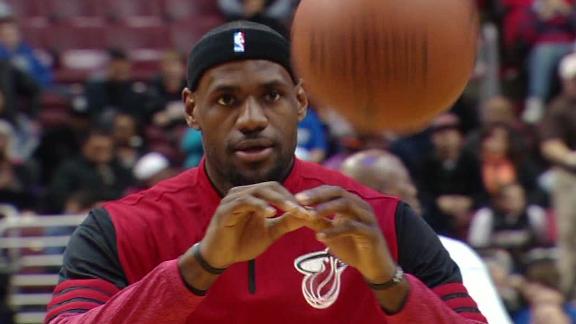 Heat win 10th in row as LeBron triple-doubles