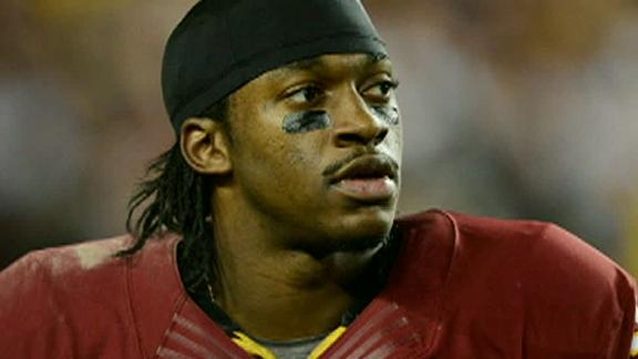 RG III tosses football to elephant at circus