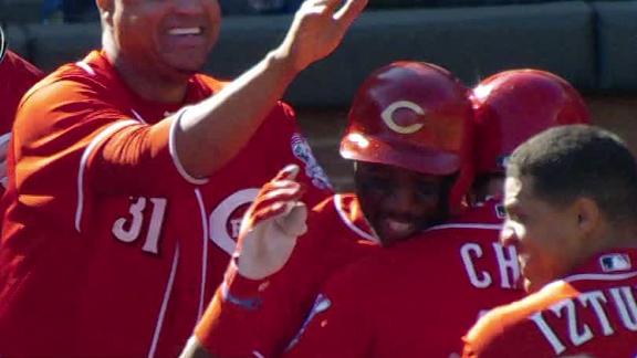 Reds close out Marlins in 13th using Phillips