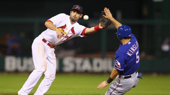 Rangers overcome rain, Wainwright for win