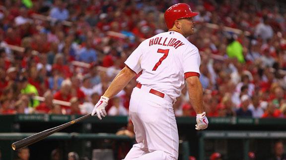 Holiday, Cards keep rolling by beating Reds