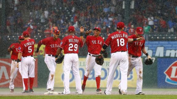 Texas keeps wild-card hopes alive with win
