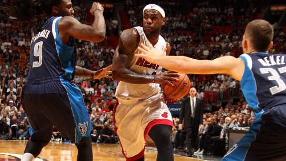 Heat outlast Mavs behind LeBron, Wade