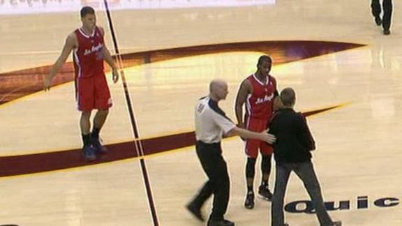 Cavs fan walks on court, displays Irving shirt