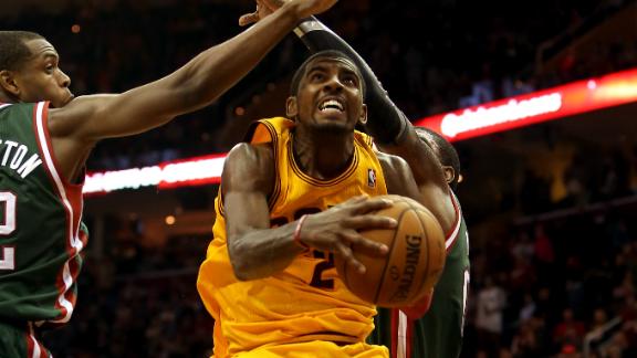 Irving scores 39 despite flu in Cavs' OT win