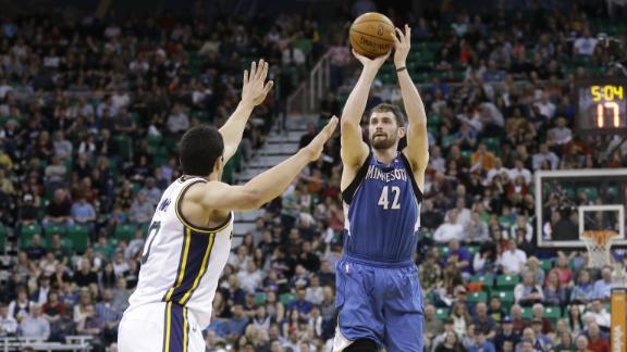 Love's 1st triple-double powers Wolves' win