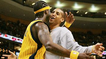 Jermaine O'Neal (L) and Reggie Miller