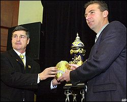 Walt Harris, left, and Urban Meyer
