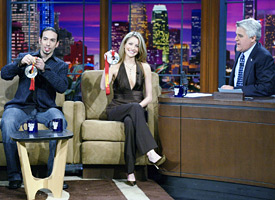 Ben Agosto, left, Tanith Belbin and Jay Leno