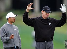 Tiger Woods, left, and Ernie Els
