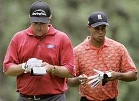 Phil Mickelson, left, and Tiger Woods