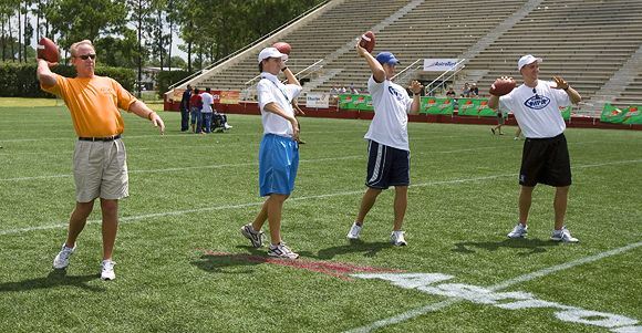 Passing fancy: Family patriarch Archie and sons Cooper, Eli and Peyton Manning.