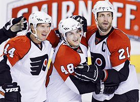 Kimmo Timonen, Daniel Briere and Jason Smith