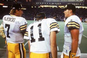 Quarterbacks Don Majkowski #7, Ty Detmer #11 and Brett Favre #4