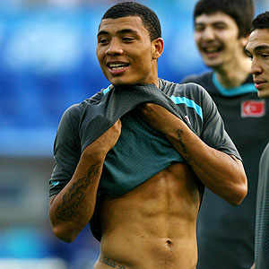 Kazim Kazim with tattoo