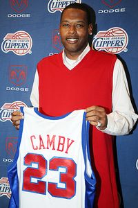 Andrew D. Bernstein/NBAE/Getty Images Marcus Camby shows off his new 